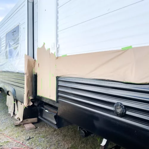 Masked off RV exterior in preparation for painting